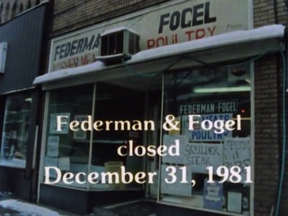 A still from Murray Ave: A Community in Transition, which reflects on the closing of Jewish businesses and changing character of the Squirrel Hill neighborhood.  The still reads: Federman and Fogel closed December 31st, 1981